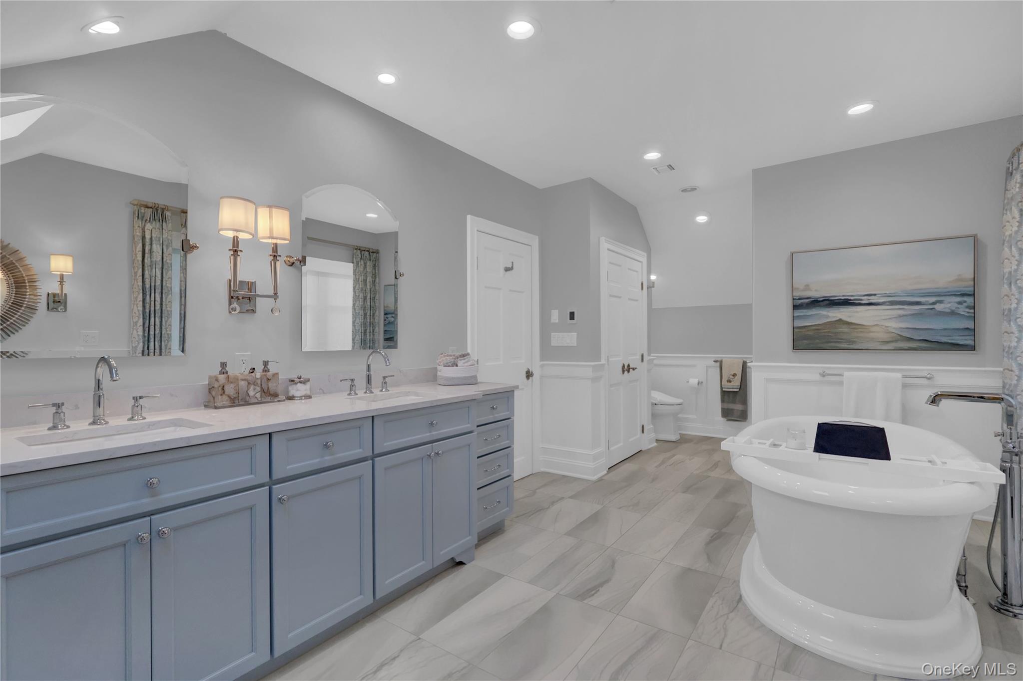 111 Old Field Road Setauket, NY 11733 - Photo 16 of 47 a bathroom with a toilet sink double vanity and mirror