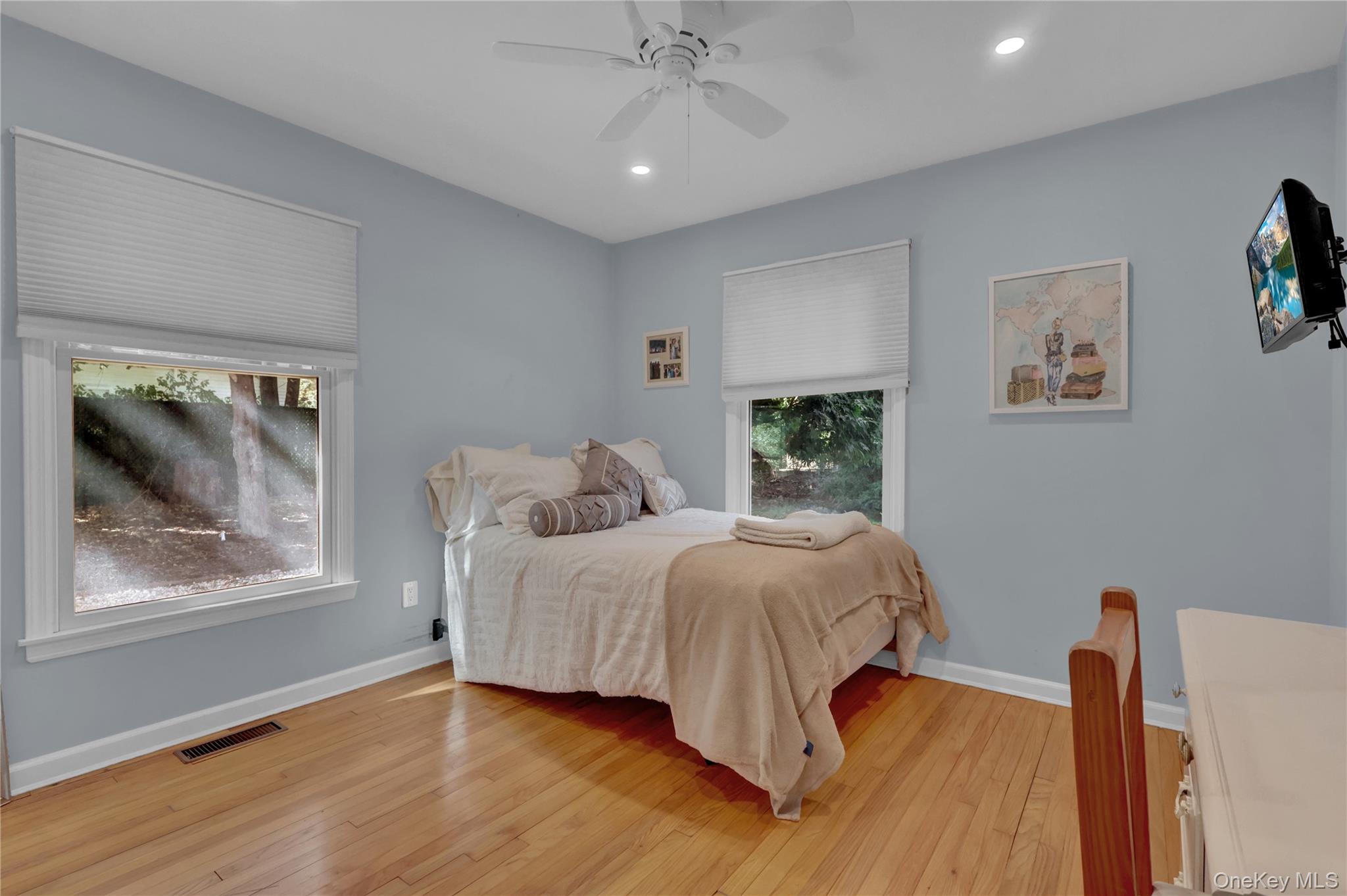 111 Old Field Road Setauket, NY 11733 - Photo 19 of 47 a bedroom with a bed and a window