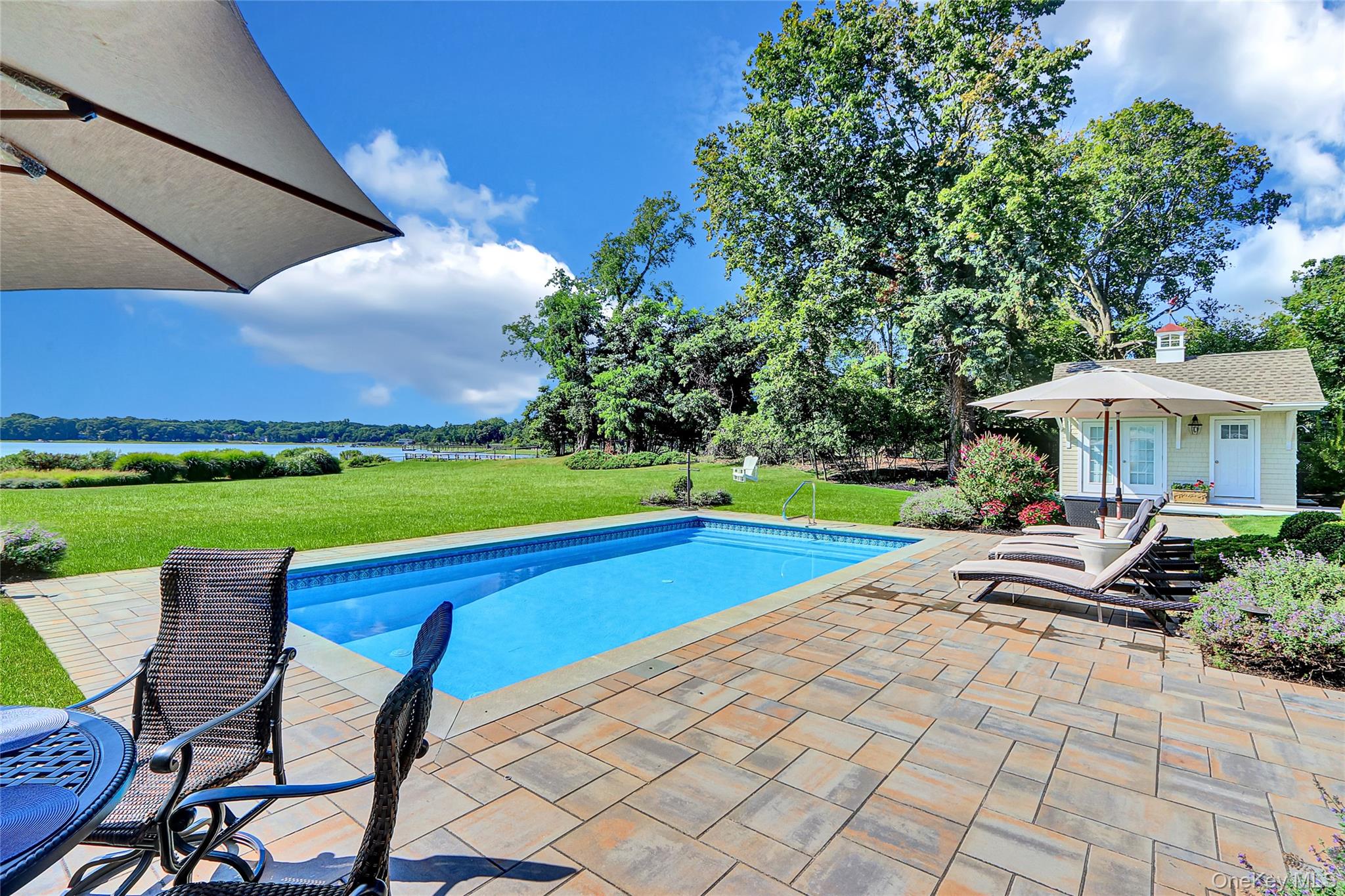 111 Old Field Road Setauket, NY 11733 - Photo 28 of 47 a view of swimming pool with lawn chairs and a yard