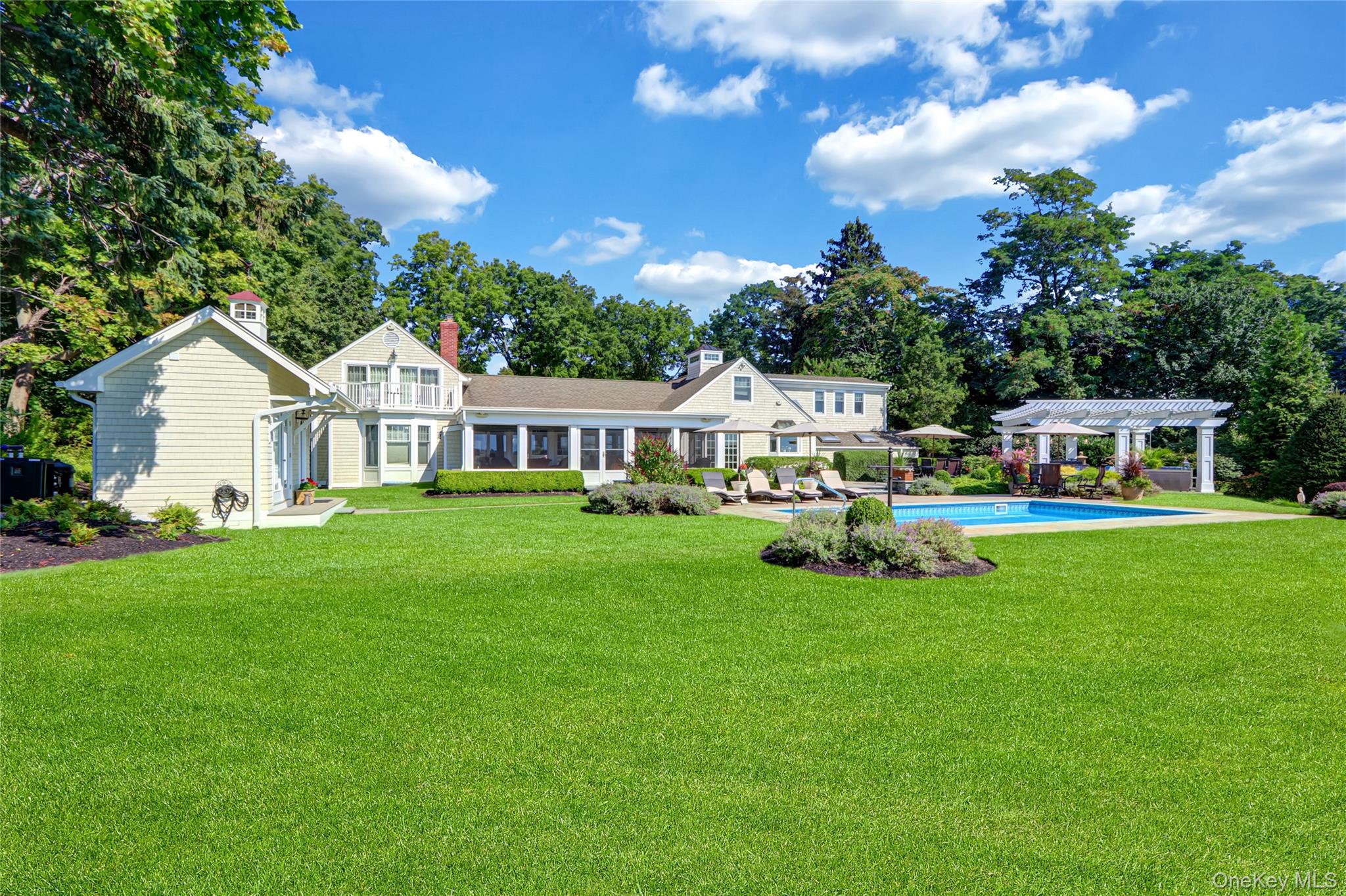 111 Old Field Road Setauket, NY 11733 - Photo 31 of 47 a view of house with garden and tall trees
