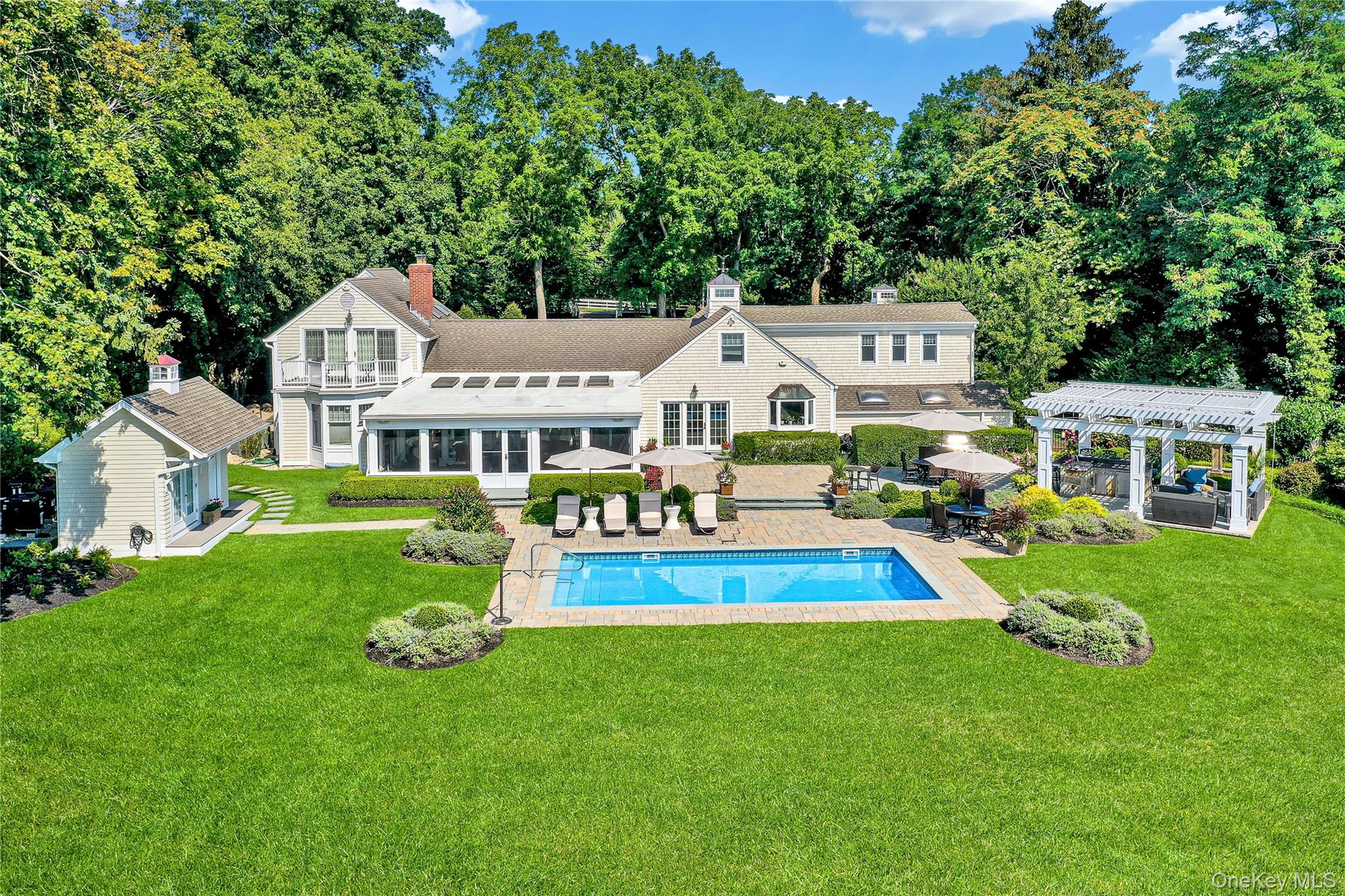 111 Old Field Road Setauket, NY 11733 - Photo 32 of 47 a aerial view of a house with a yard table and chairs