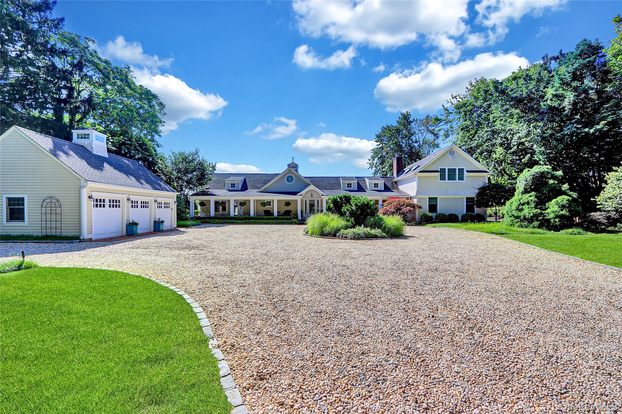 111 Old Field Road Setauket, NY 11733 - Photo 4 of 47 a front view of a house with a yard and garage