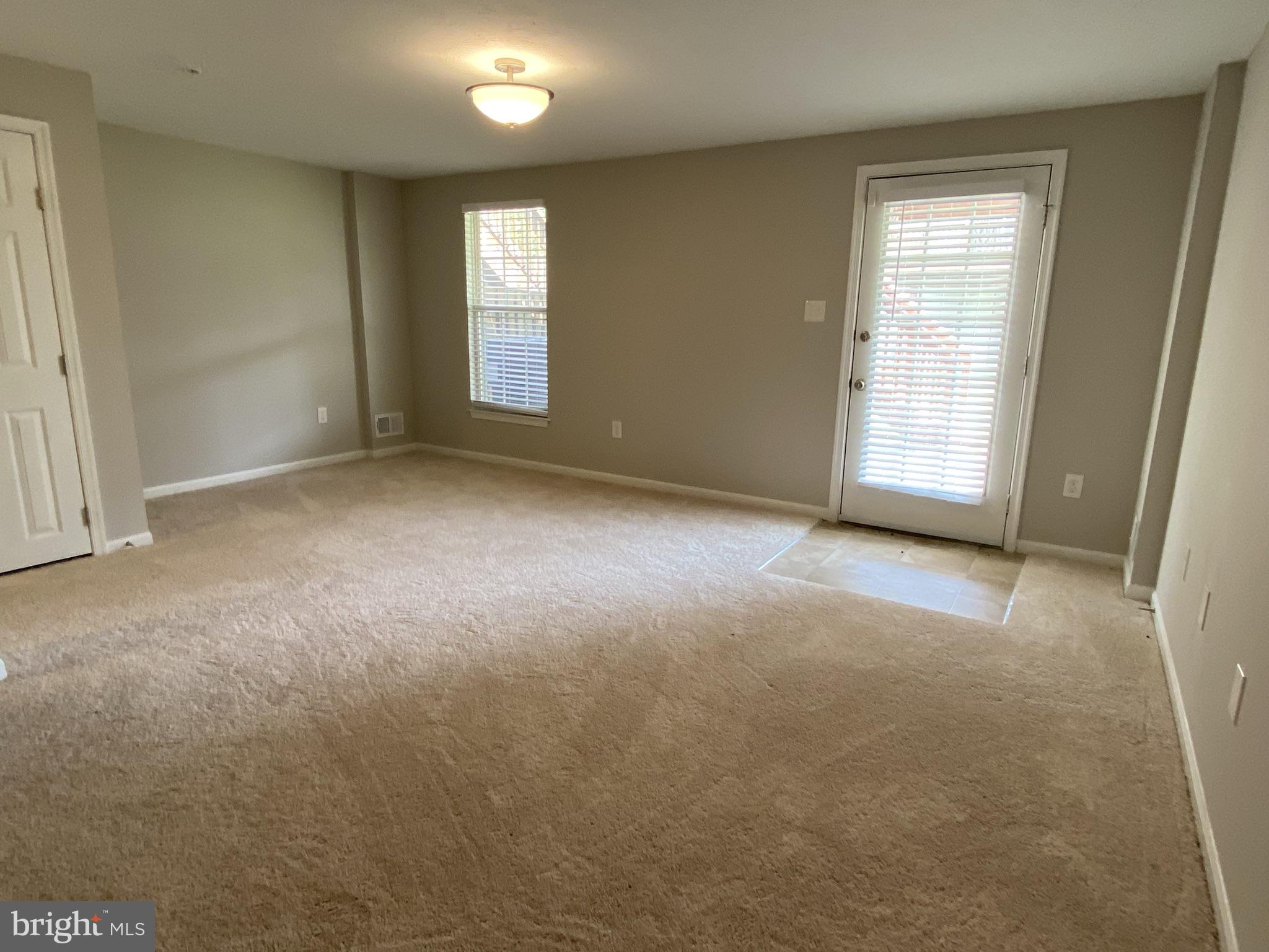 9419 Joleon Road Randallstown, MD 21133 - Photo 15 of 18 Family Room with door leading to outdoor patio