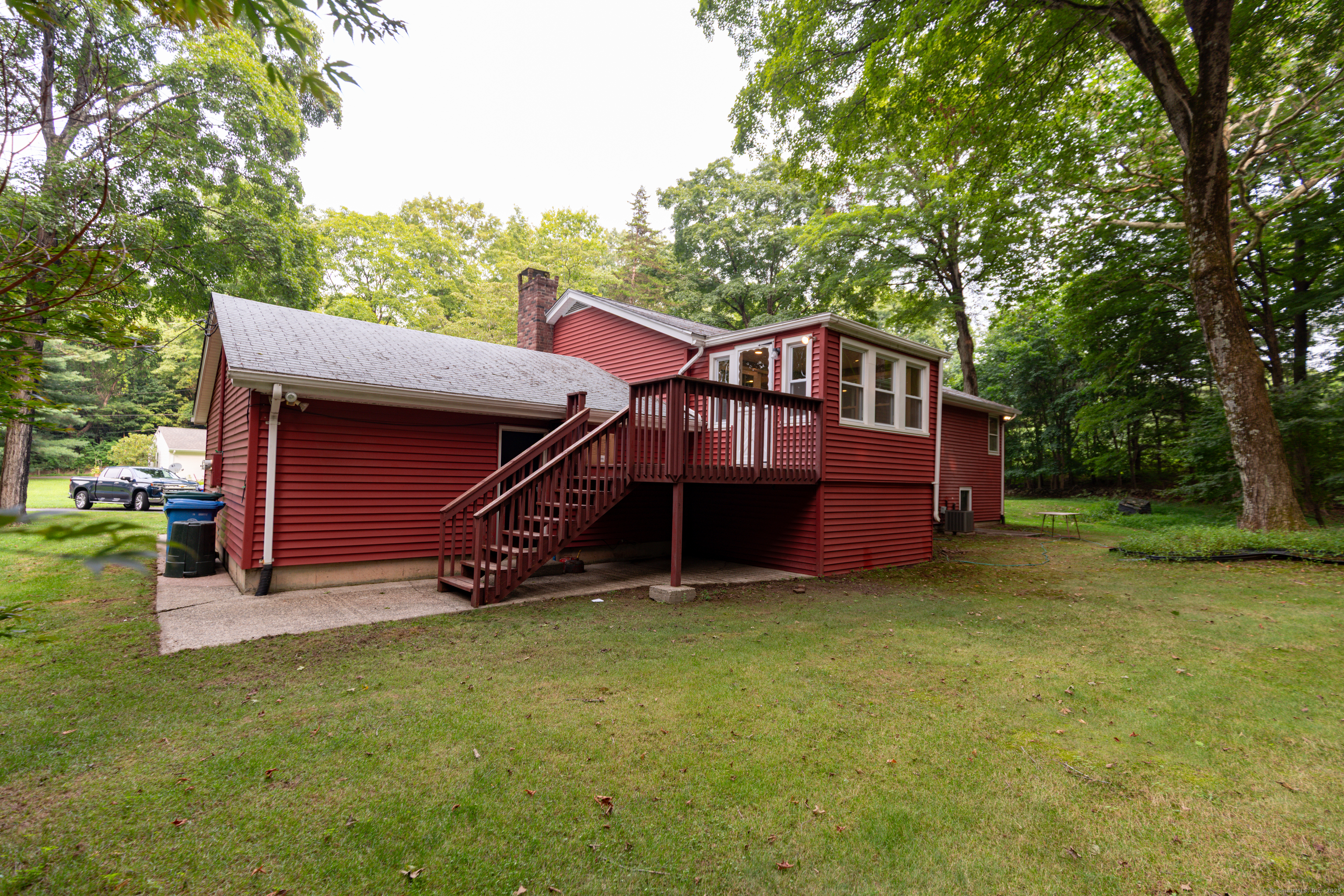 45 Renshaw Road Hamden, CT 06518 - Photo 3 of 26 a view of a house with a yard and sitting area