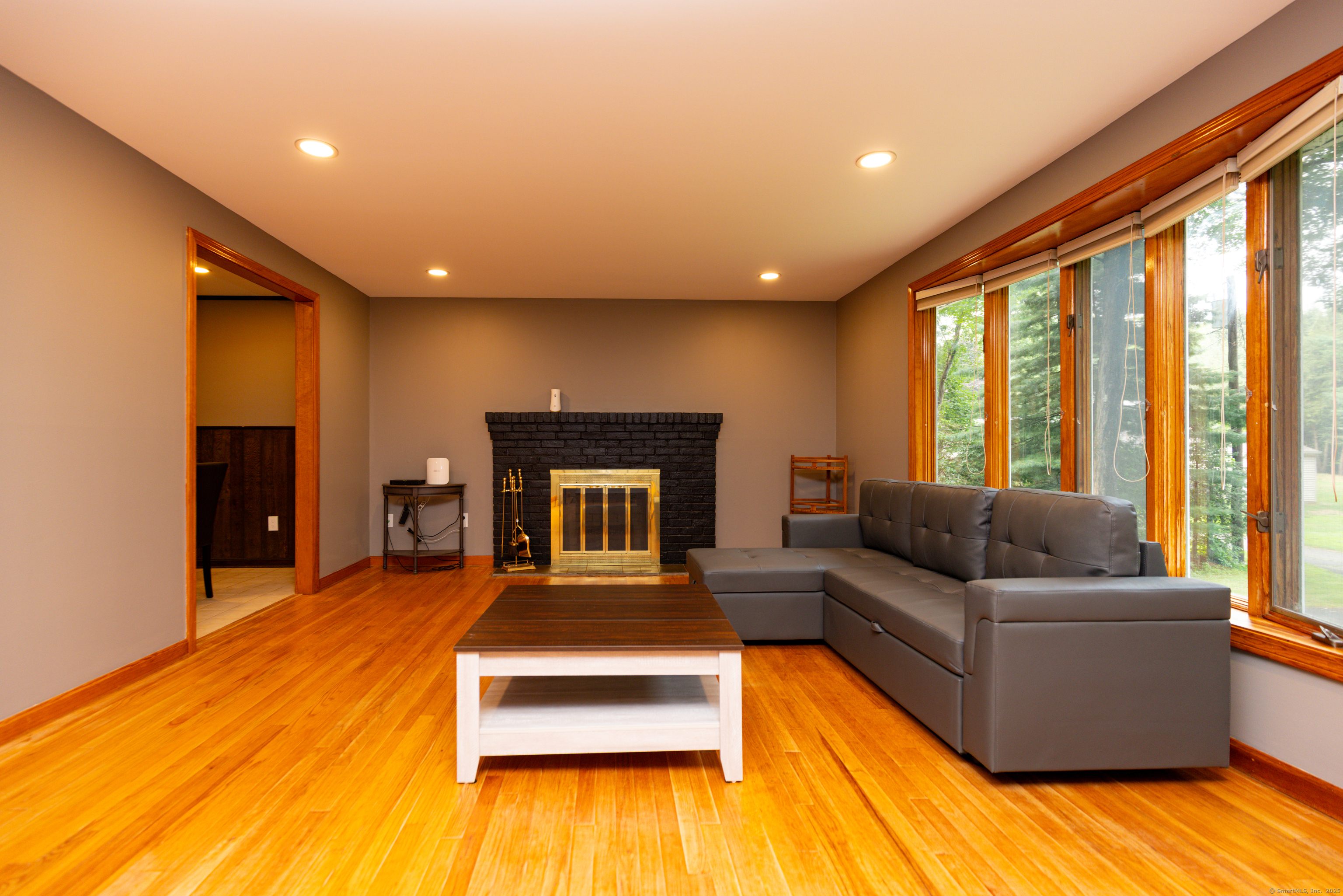 45 Renshaw Road Hamden, CT 06518 - Photo 5 of 26 a living room with furniture and a fireplace