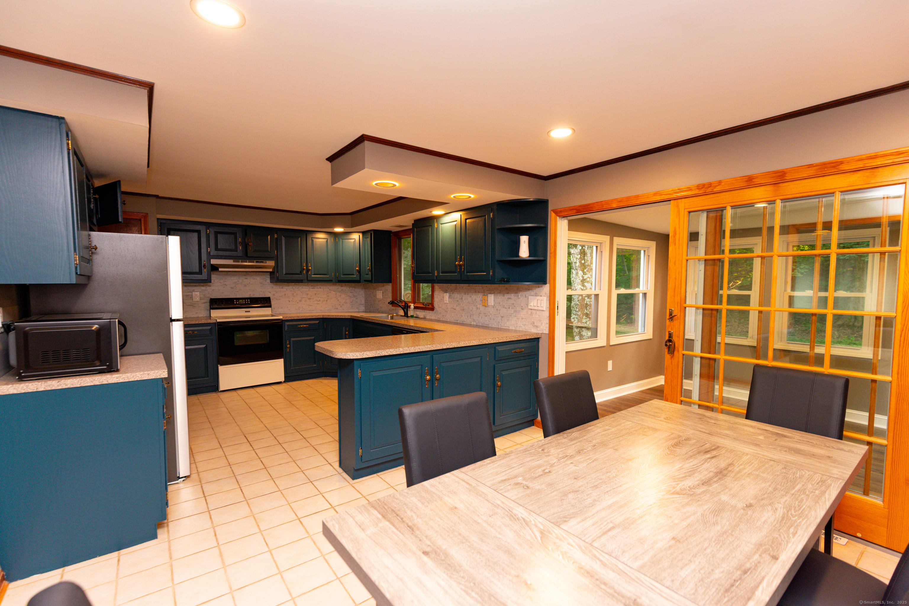 45 Renshaw Road Hamden, CT 06518 - Photo 9 of 26 a large kitchen with stainless steel appliances kitchen island a large counter top