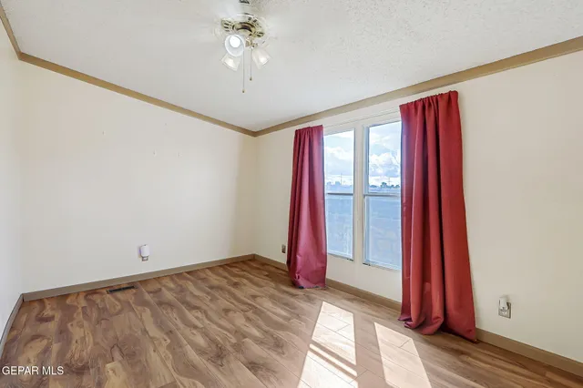 a kitchen with kitchen island a stove a sink and a refrigerator