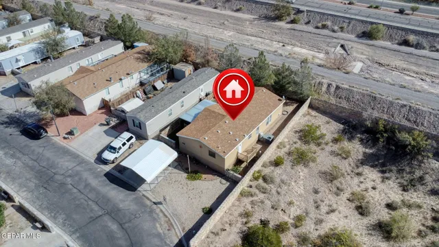 with sign on a wall next to a road