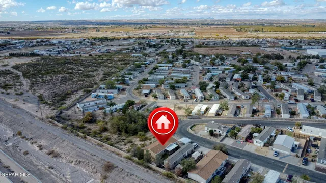 an aerial view of a house and a yard
