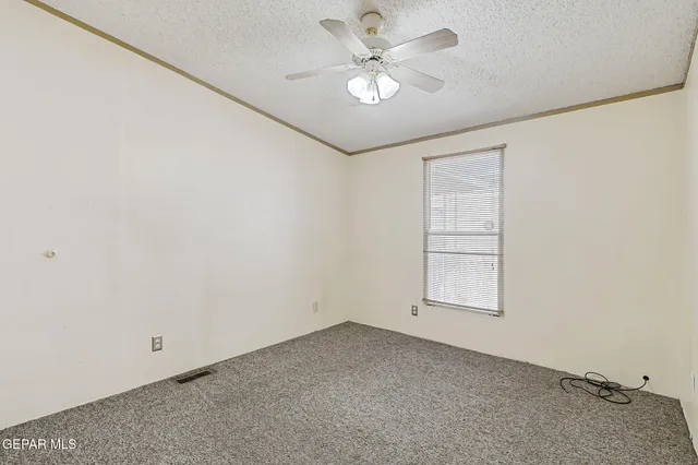 a view of livingroom with hardwood floor and a ceiling fan