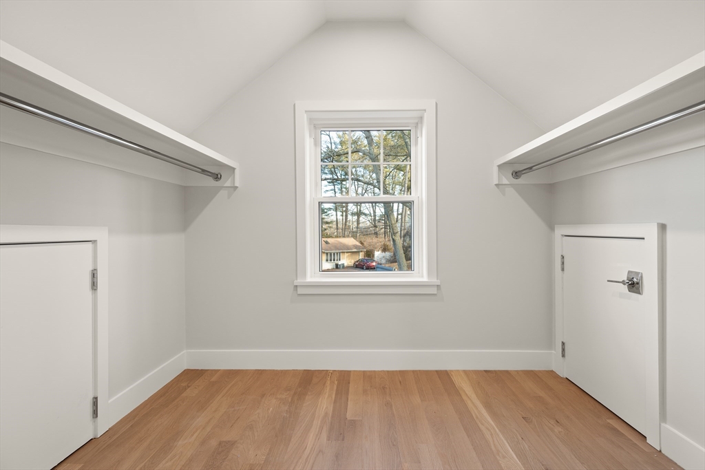 14 Benjamin Road Lexington, MA 02421 - Photo 32 of 35 a view of an empty room with wooden floor and a window