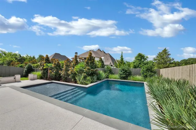 a view of a patio with a yard
