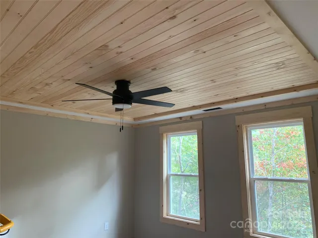 a water heater sitting in a room next to a window