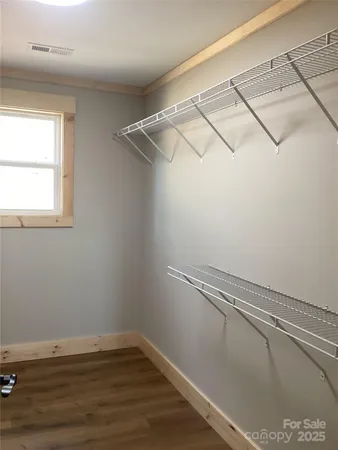 a view of a room with racks on the wall