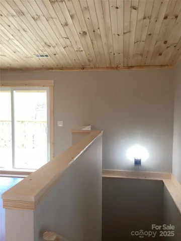 a view of a hallway with a window