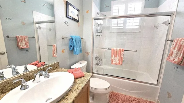 a kitchen with a stove a refrigerator and a dining table