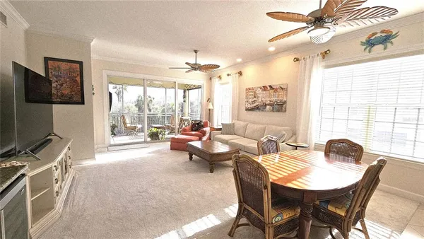 a bedroom with furniture and a flat screen tv