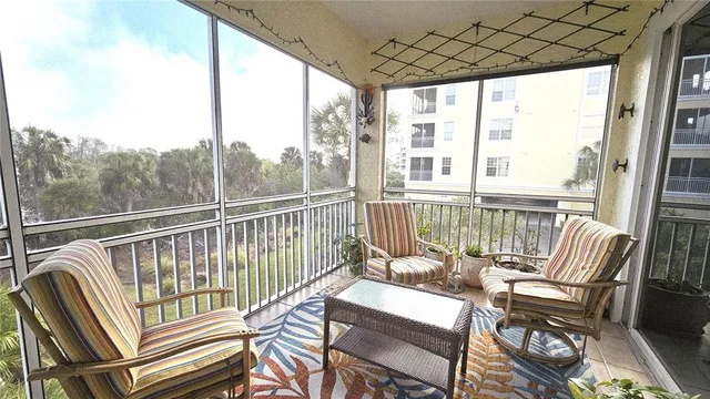 a bathroom with a tub a sink and glass door