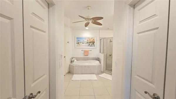 a bathroom with a sink a mirror a bathtub and a toilet