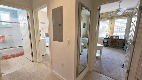 a spacious bedroom with a bed and a dresser