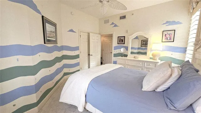 a kitchen with kitchen island granite countertop a sink counter top space appliances and a window