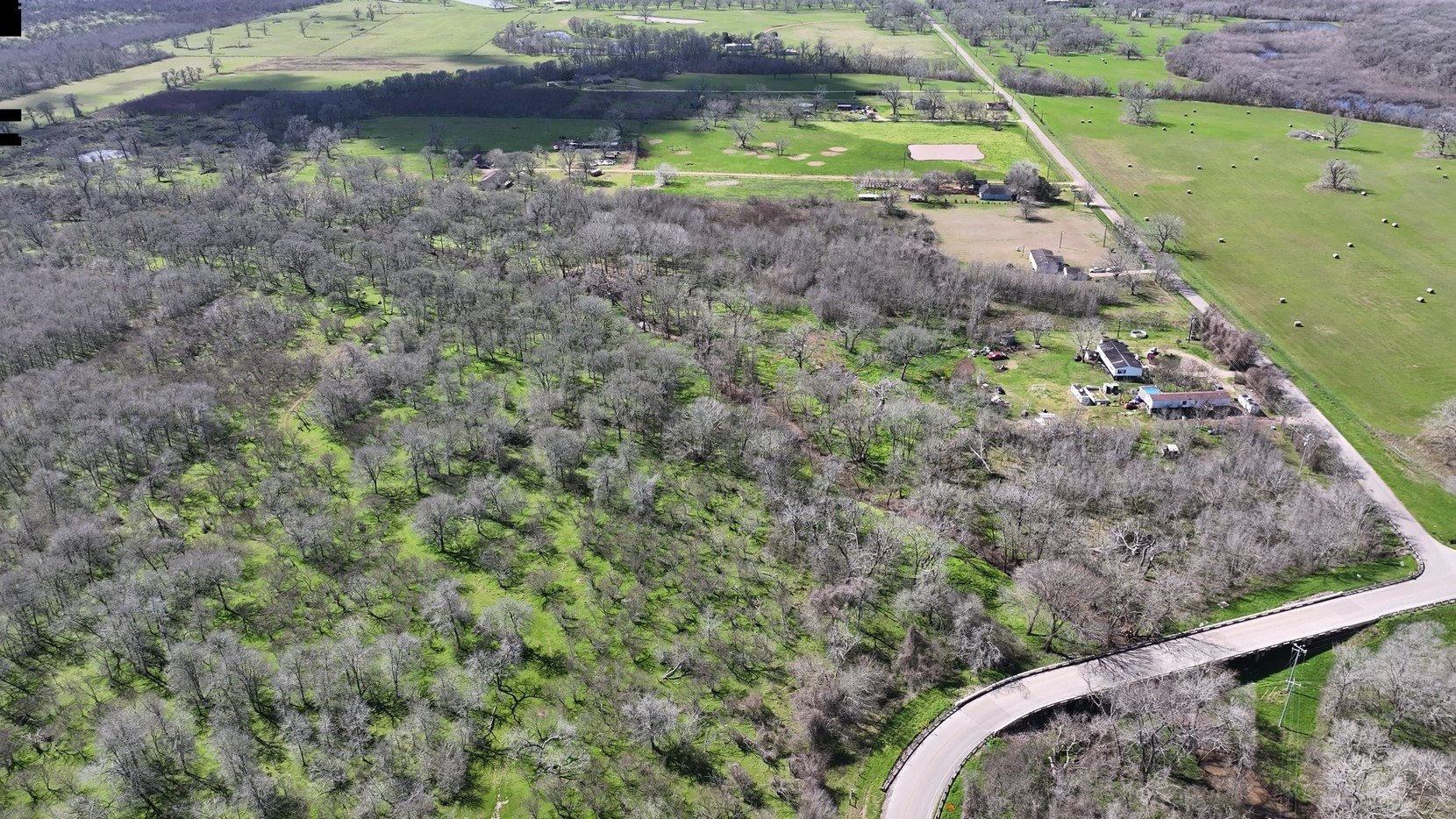 40499 Garrett Road Brookshire, TX 77423 - Photo 13 of 29 a view of a backyard with plants and a yard
