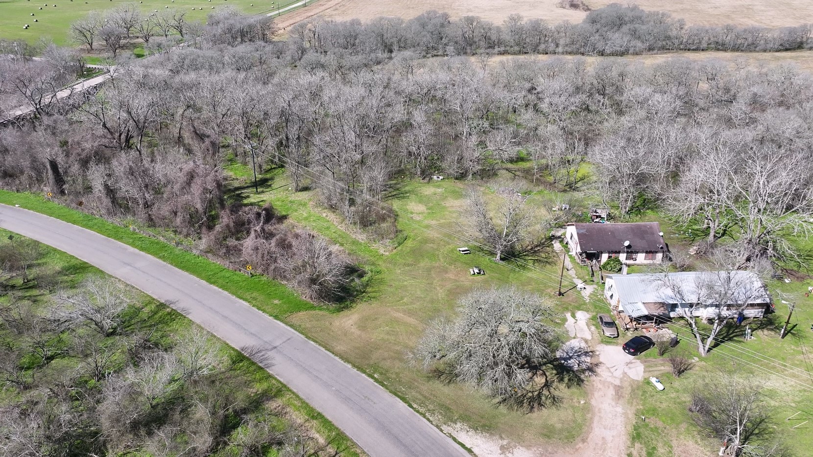 40499 Garrett Road Brookshire, TX 77423 - Photo 10 of 29 a aerial view of a house with a yard and greenery