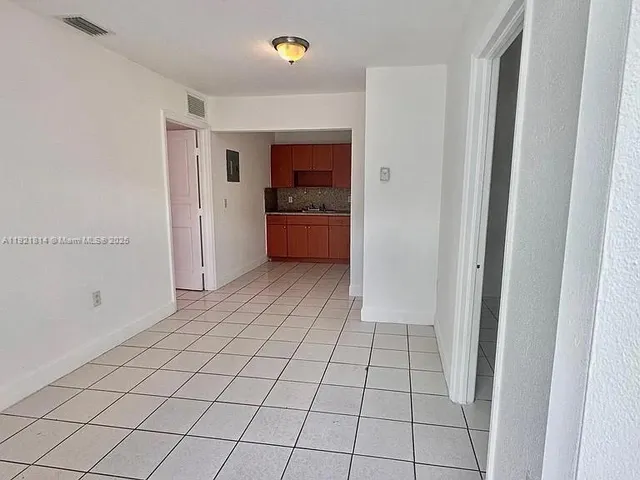 a view of an empty room and window