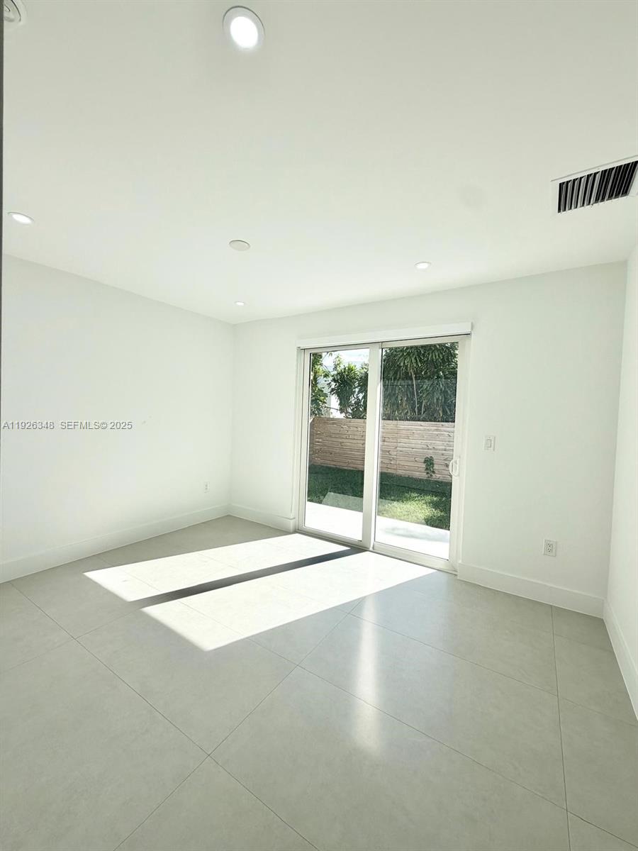 524 Northeast 65th Street, Unit 2 Miami, FL 33138 - Photo 12 of 24 a view of an empty room with a window