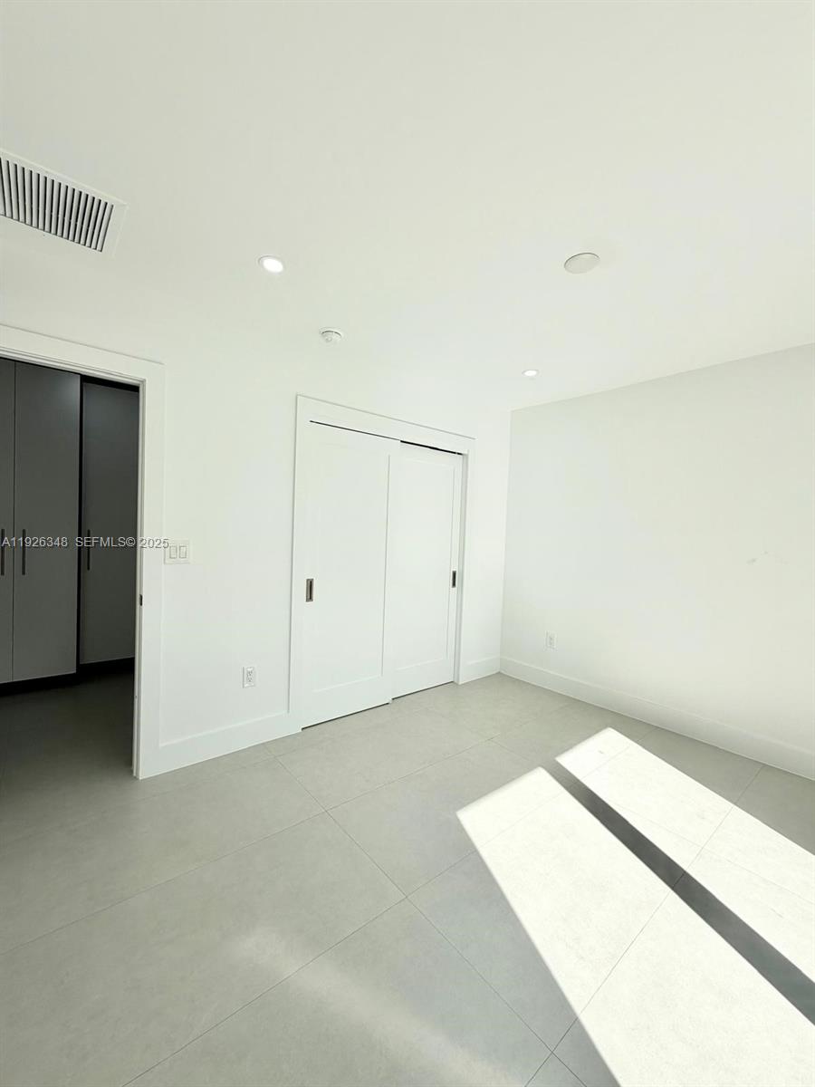 524 Northeast 65th Street, Unit 2 Miami, FL 33138 - Photo 13 of 24 an empty room with closet
