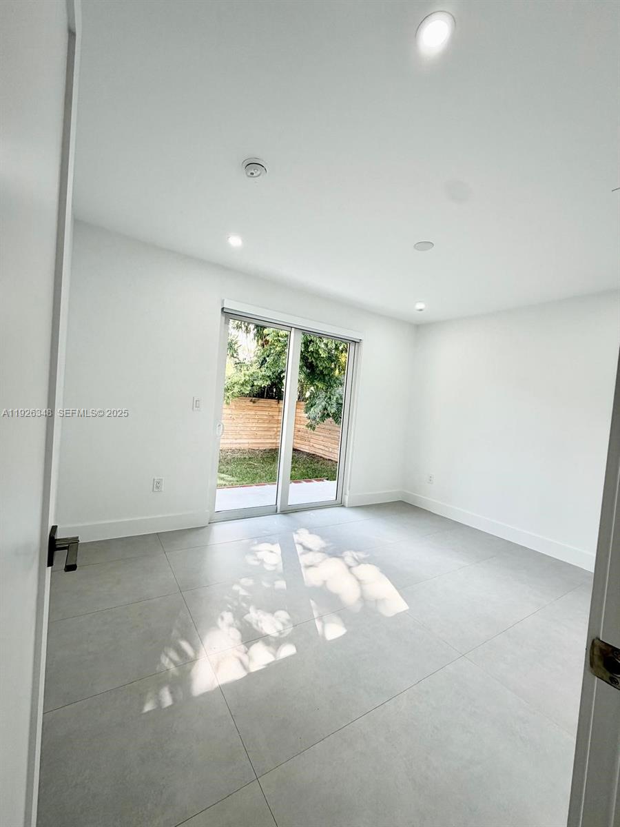 524 Northeast 65th Street, Unit 2 Miami, FL 33138 - Photo 14 of 24 a view of an empty room with a window