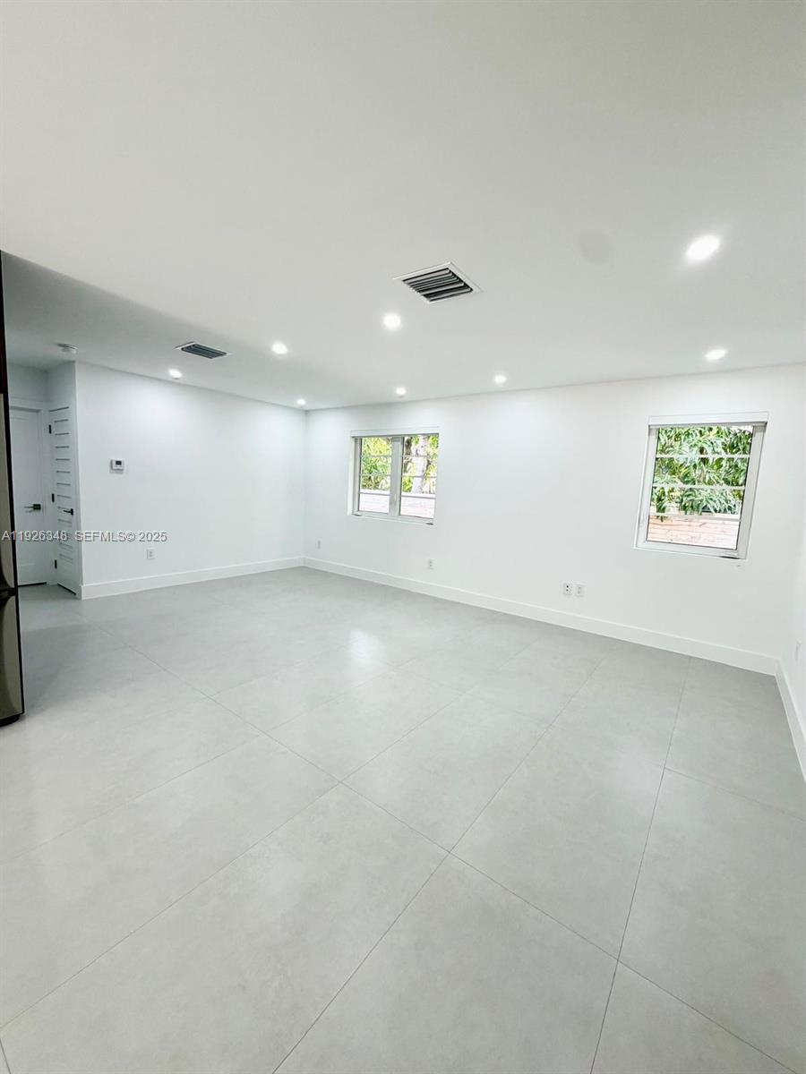 524 Northeast 65th Street, Unit 2 Miami, FL 33138 - Photo 9 of 24 an empty room with windows