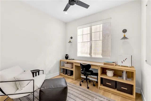 a bedroom with furniture and a window