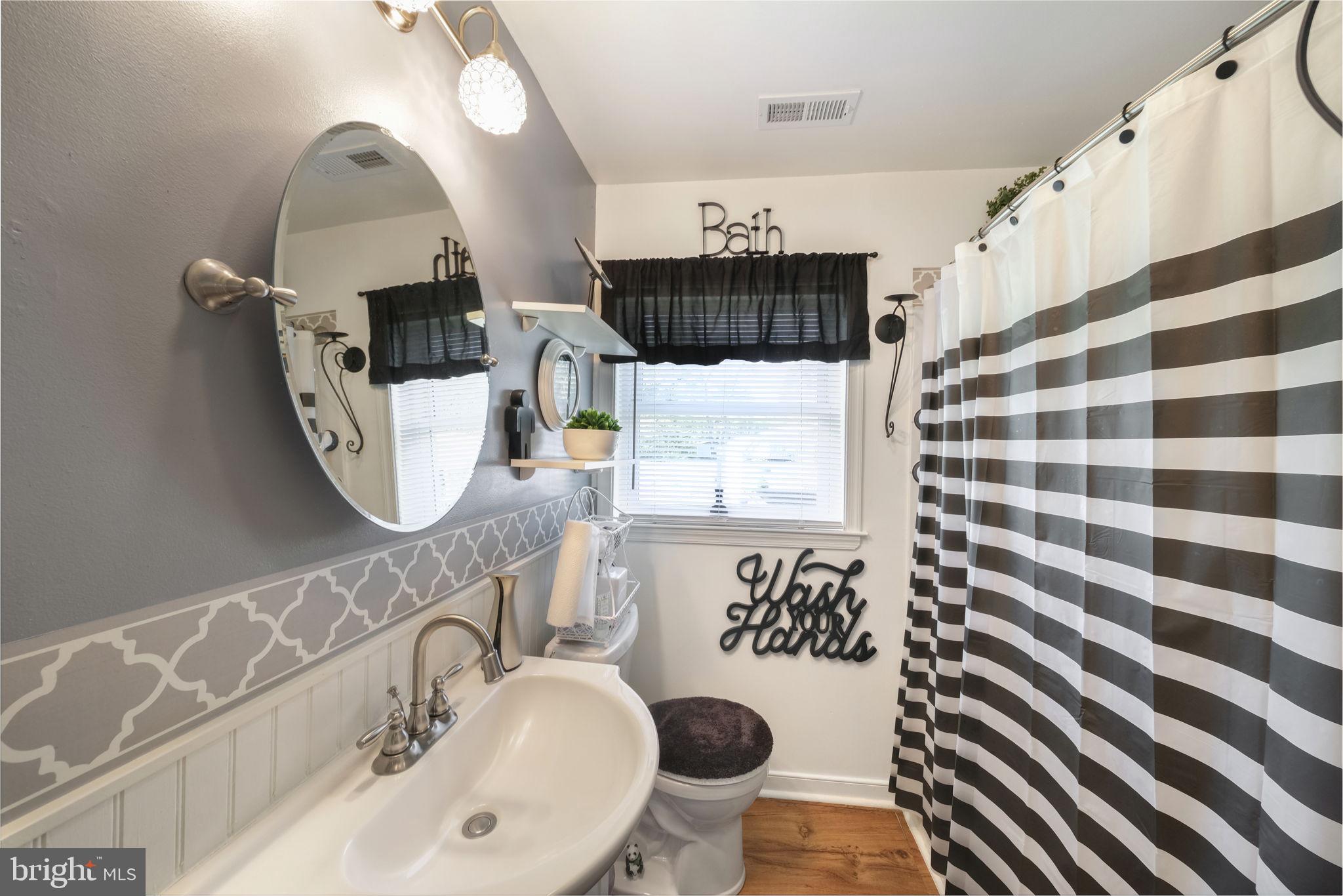 20384 Mary Ball Road White Stone, VA 22578 - Photo 16 of 31 Chic bathroom with modern accents.