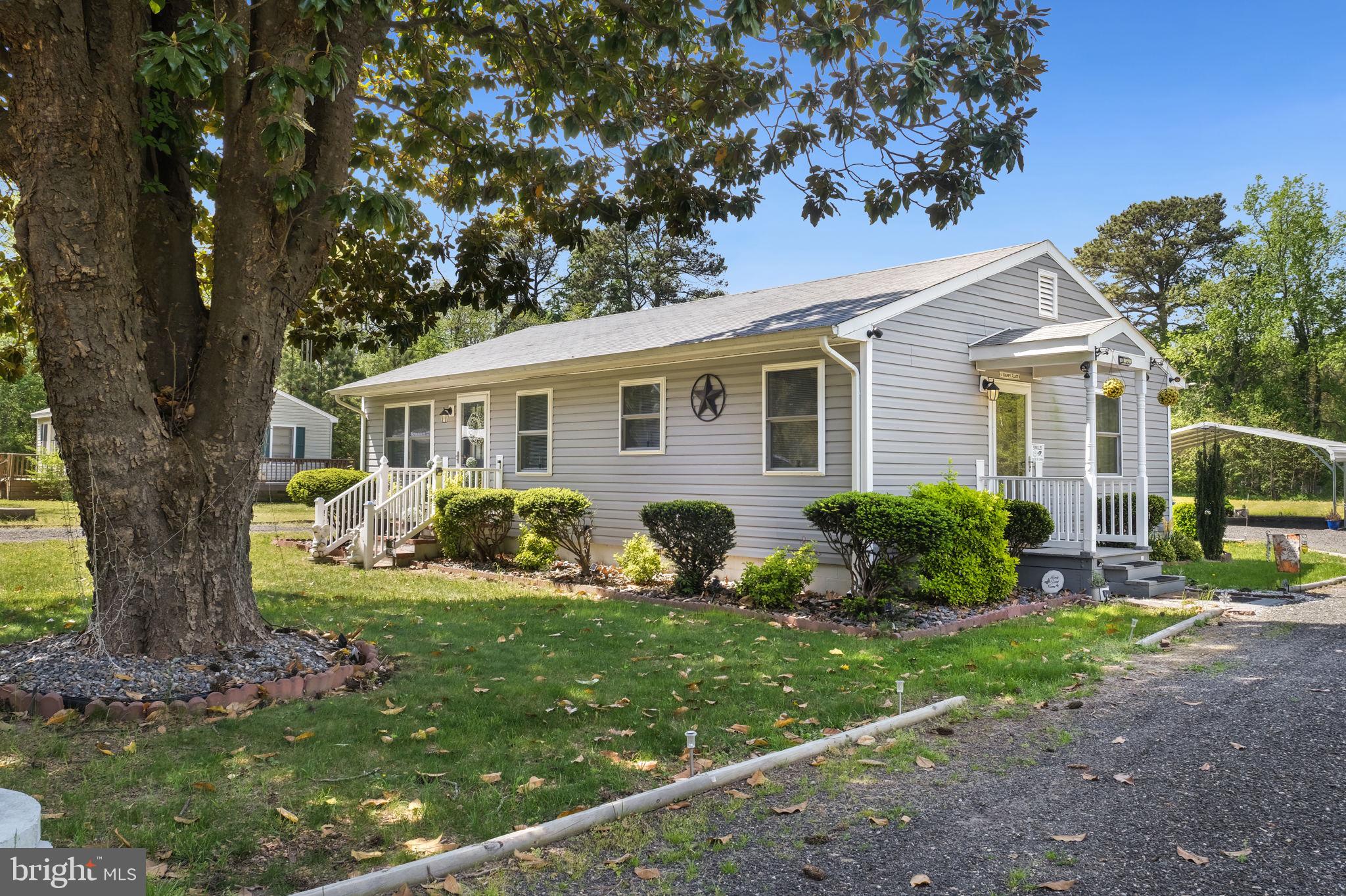 20384 Mary Ball Road White Stone, VA 22578 - Photo 2 of 31 Charming home with lush greenery.