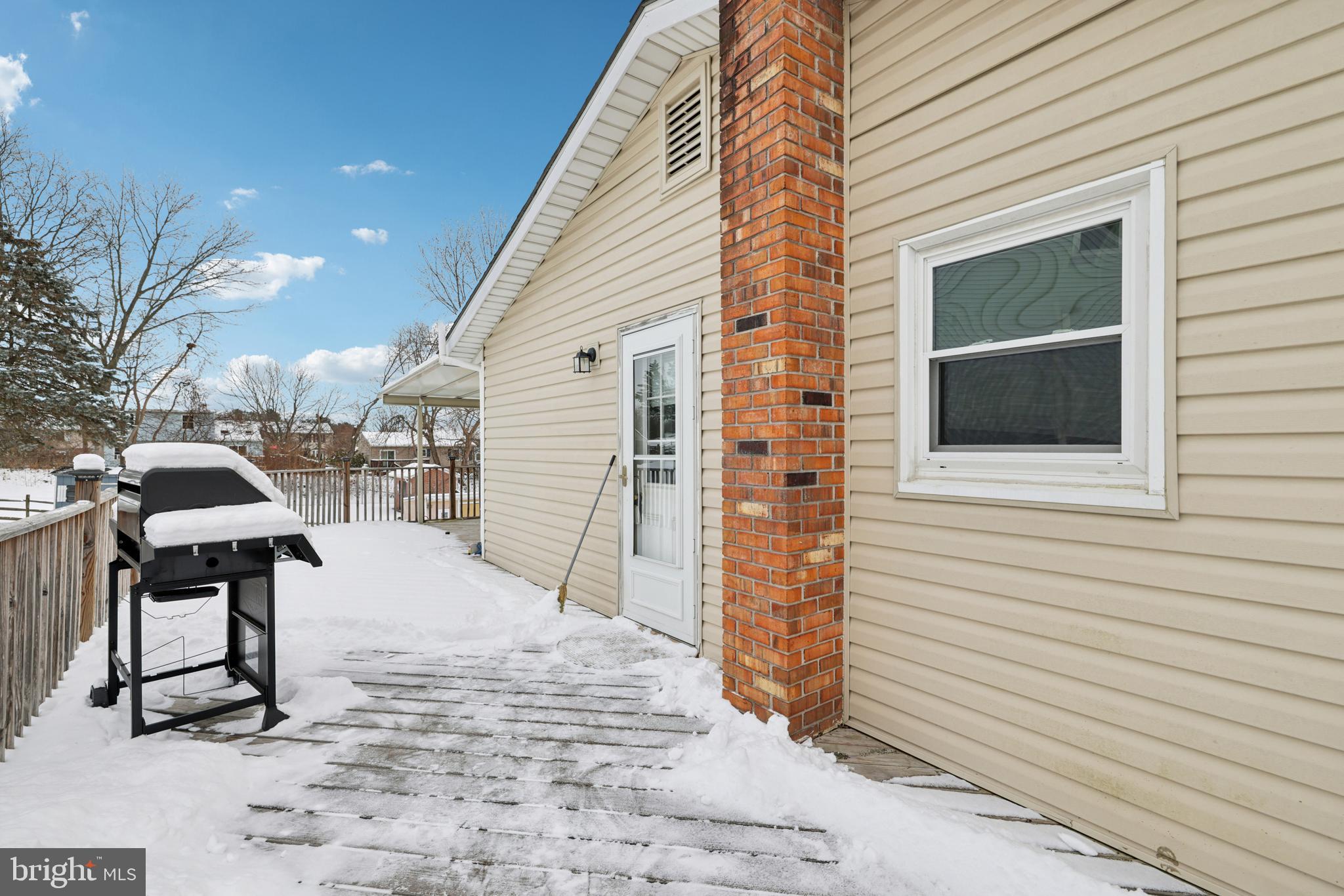 917 Century Street Hampstead, MD 21074 - Photo 36 of 45 a backyard of a house with table and chairs
