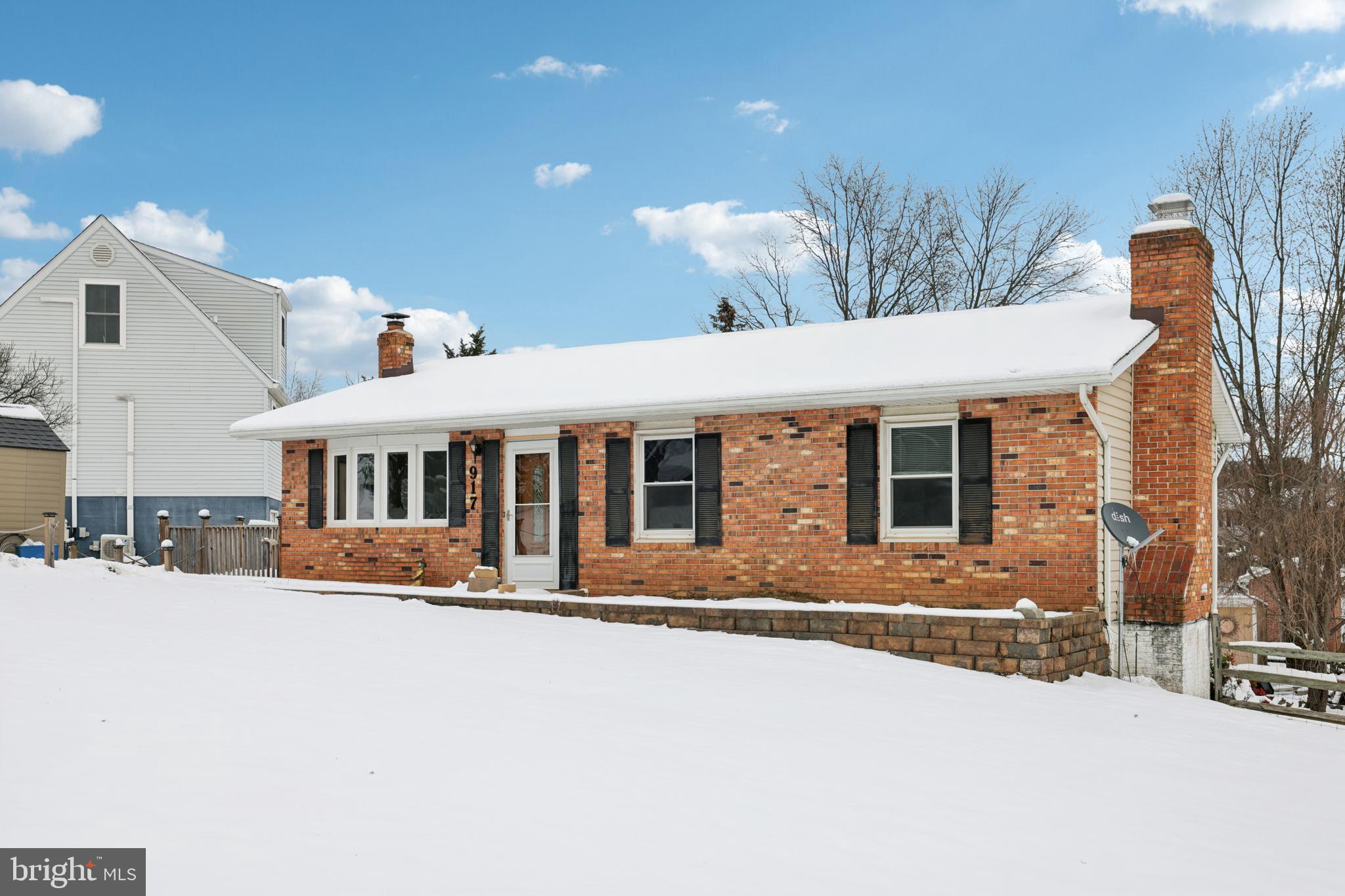 917 Century Street Hampstead, MD 21074 - Photo 4 of 45 a front view of a house with a yard