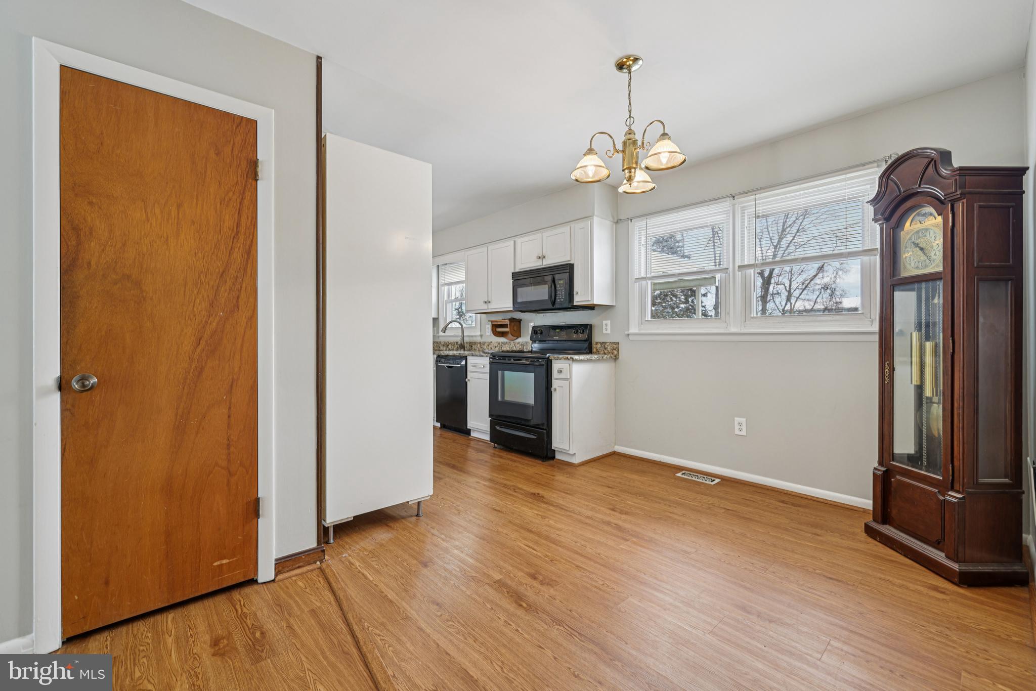 917 Century Street Hampstead, MD 21074 - Photo 9 of 45 a view of a kitchen with stainless steel appliances granite countertop a refrigerator and a stove top oven