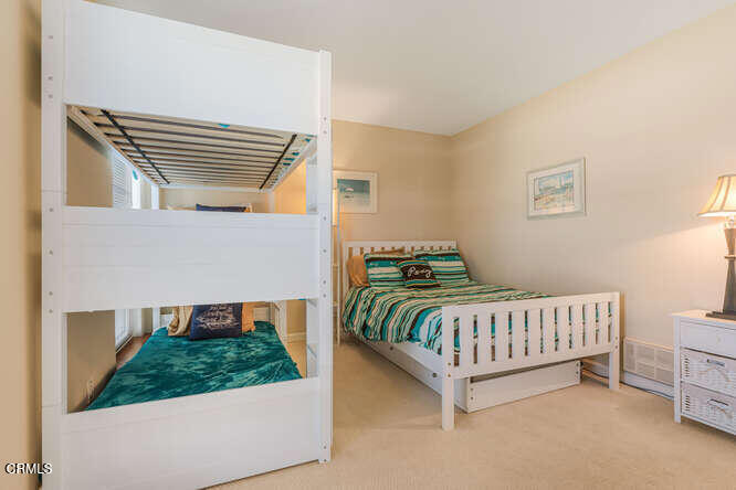 3101 Peninsula Road, Unit 115 Oxnard, CA 93035 - Photo 19 of 36 a bedroom with a bed and a window