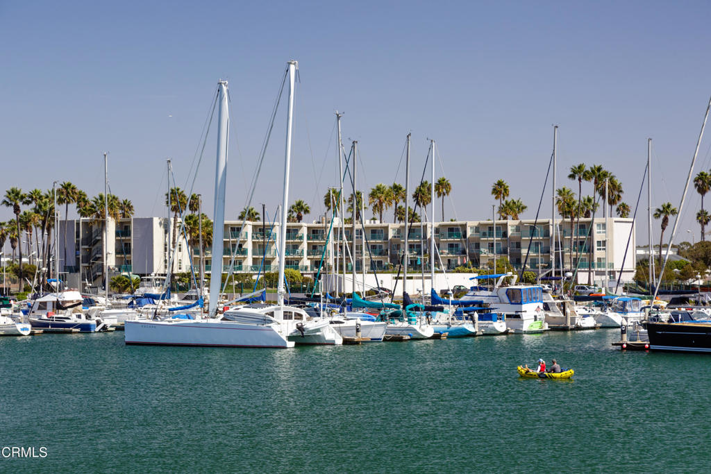 3101 Peninsula Road, Unit 115 Oxnard, CA 93035 - Photo 27 of 36 a view of a lake with boats and palm trees