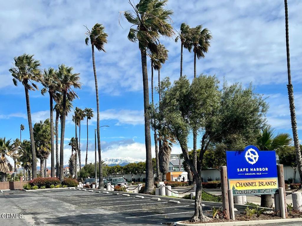 3101 Peninsula Road, Unit 115 Oxnard, CA 93035 - Photo 29 of 36 a view of a street with a building and palm trees