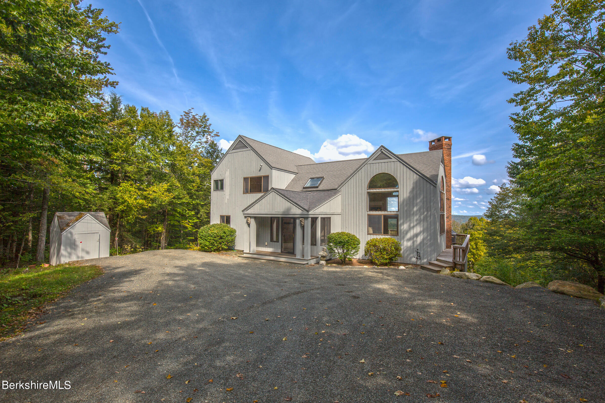 795 Moberg Road Becket, MA 01223 - Photo 1 of 41 a front view of a house with garden