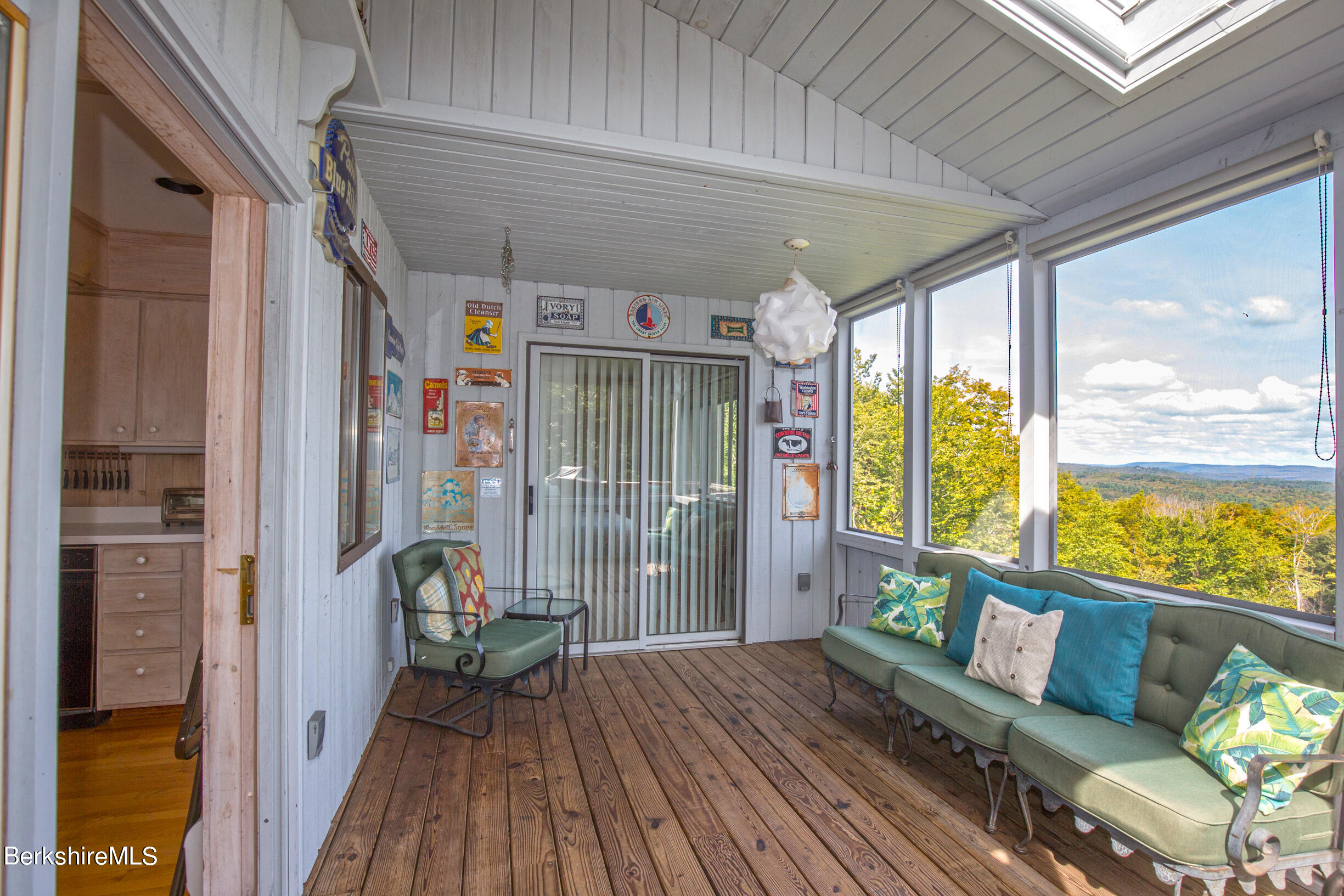 795 Moberg Road Becket, MA 01223 - Photo 12 of 41 a balcony with furniture and wooden floor