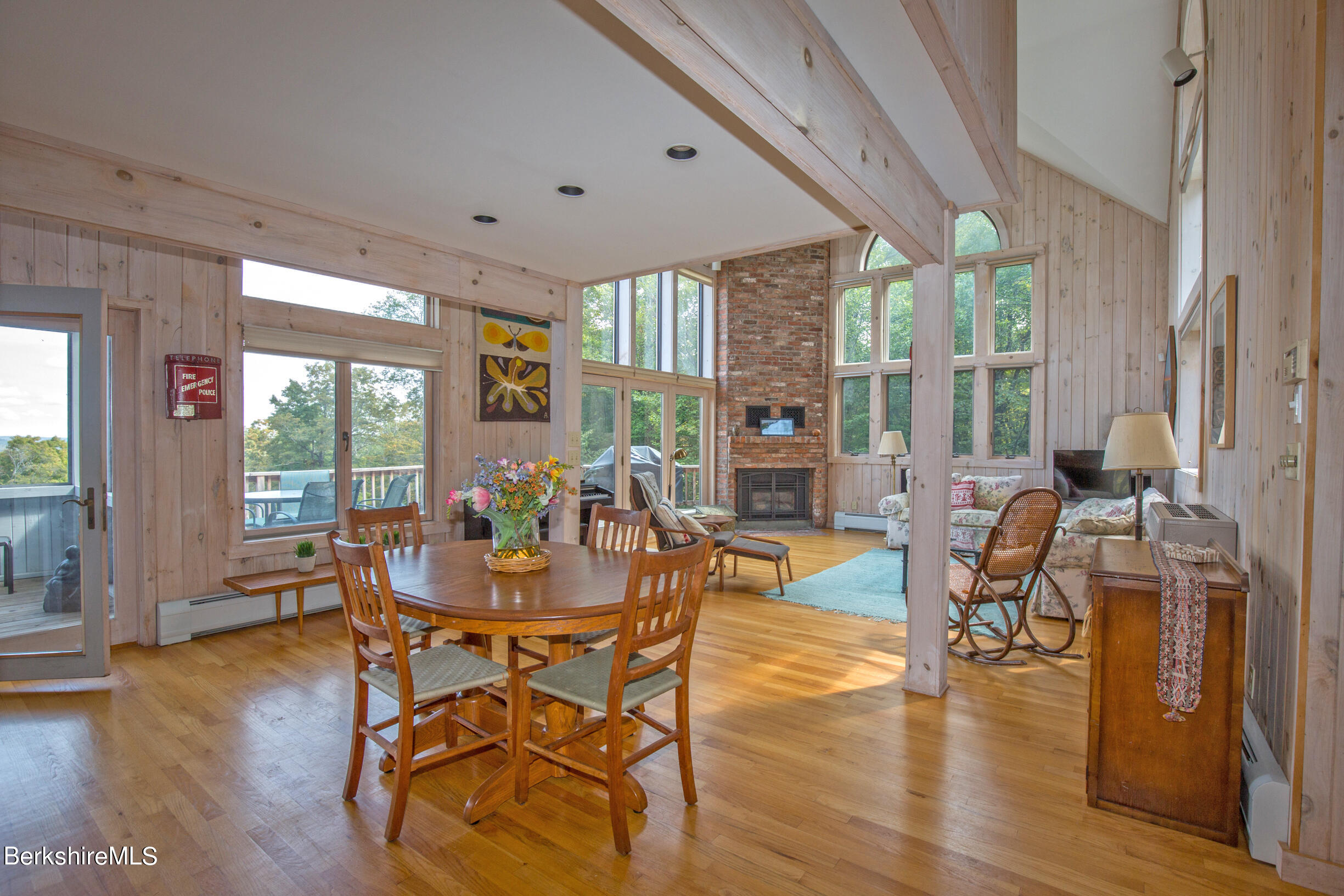 795 Moberg Road Becket, MA 01223 - Photo 14 of 41 a view of a dining room with furniture window and wooden floor