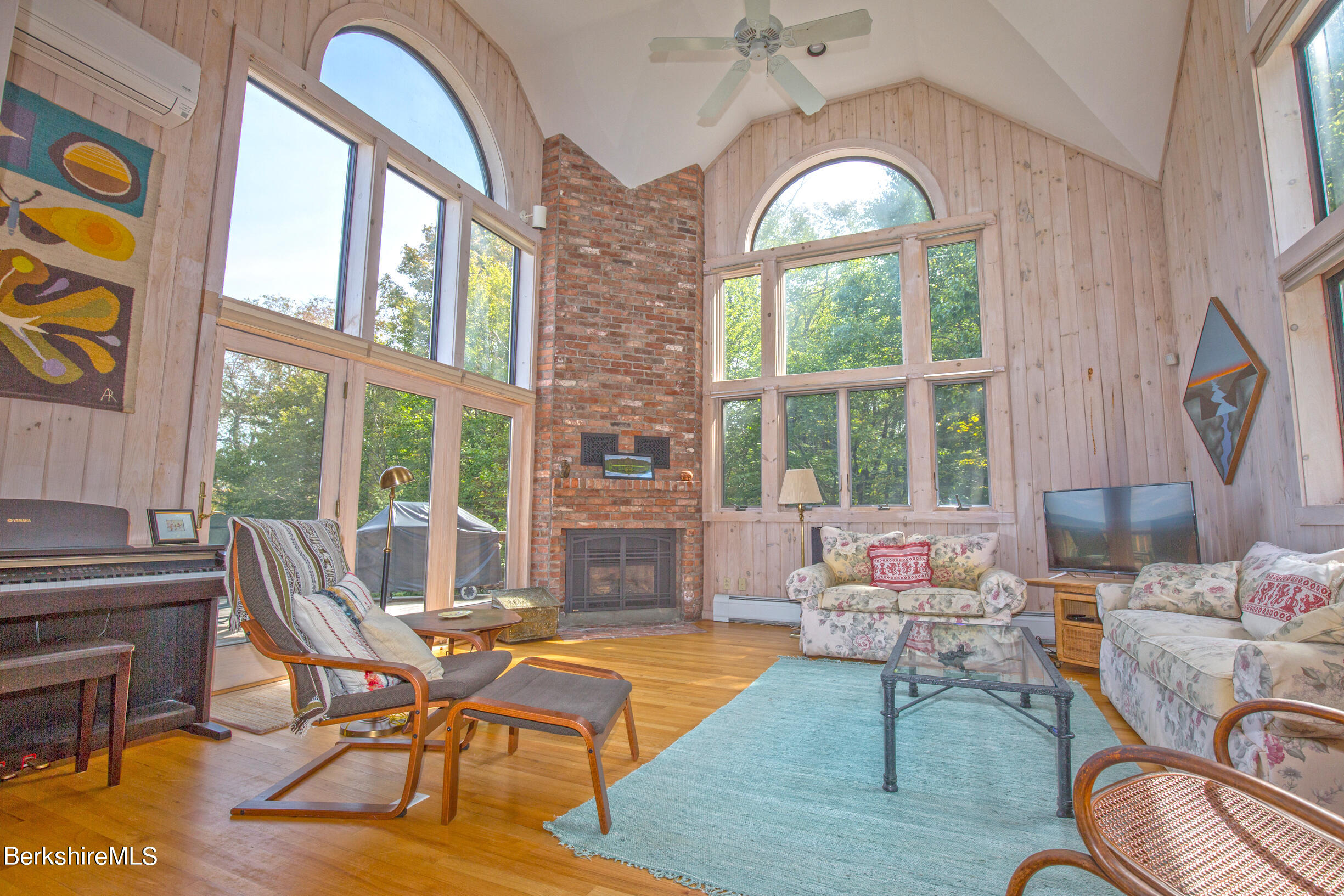 795 Moberg Road Becket, MA 01223 - Photo 15 of 41 a living room with furniture and a large window