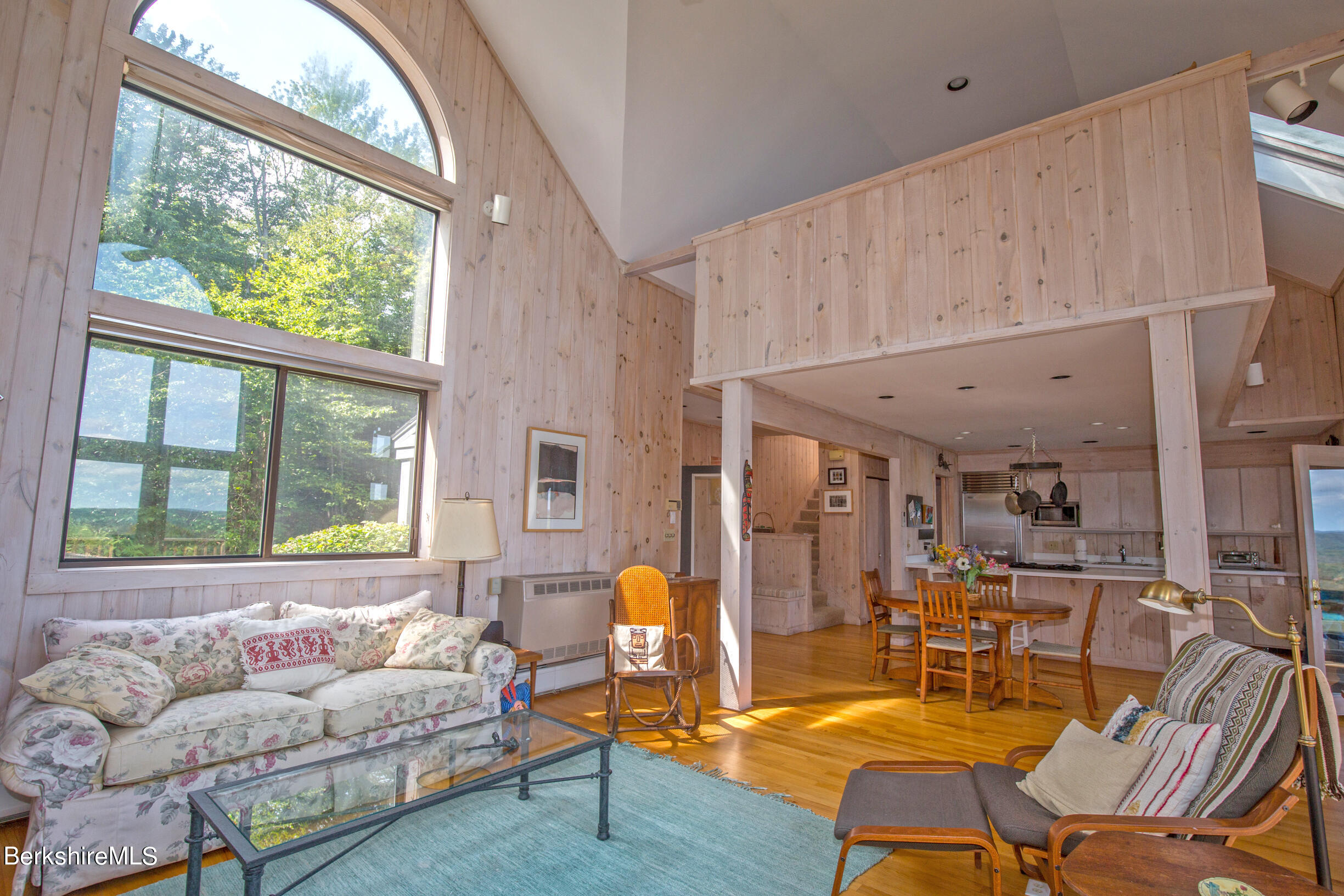 795 Moberg Road Becket, MA 01223 - Photo 17 of 41 a living room with furniture and a large window