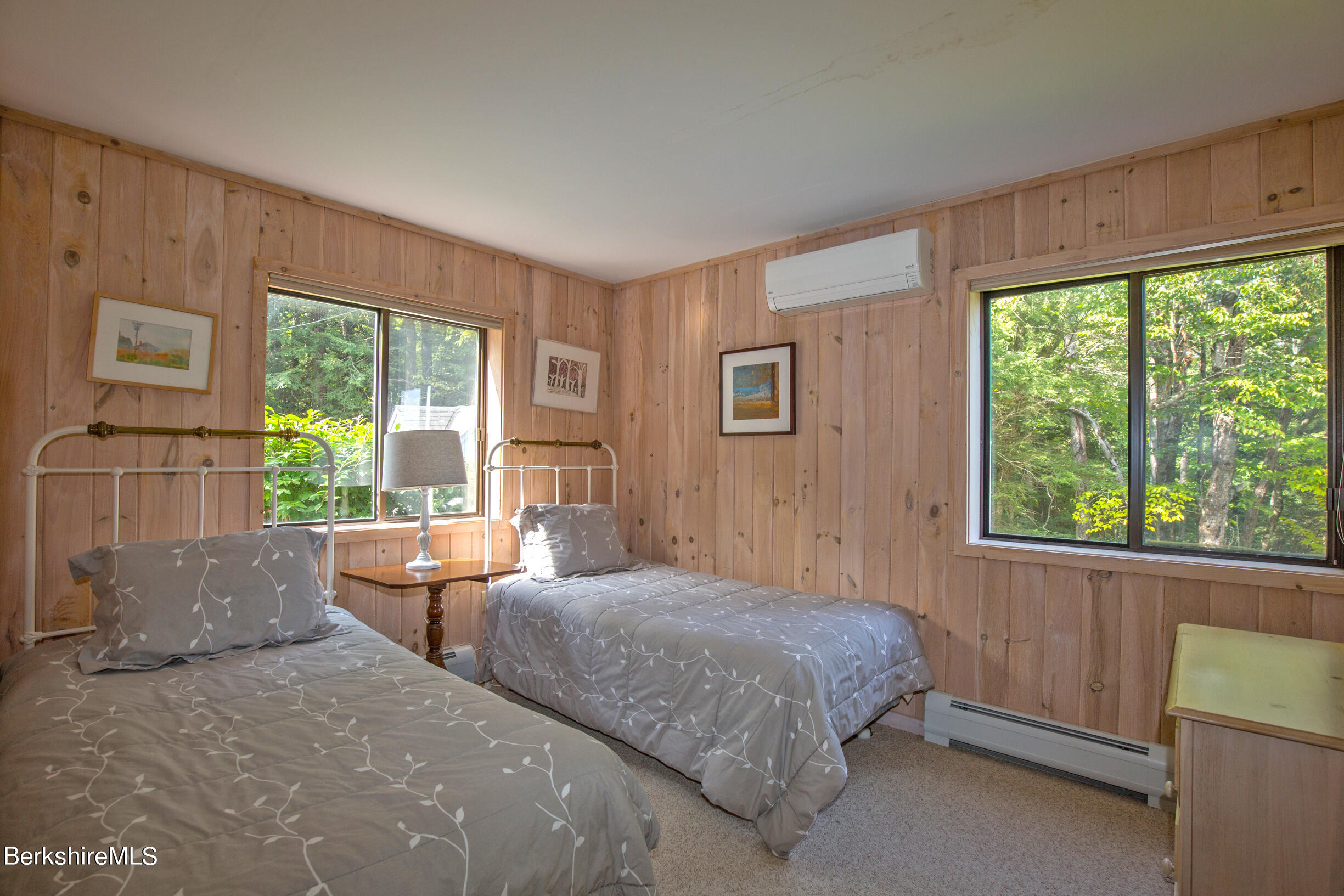 795 Moberg Road Becket, MA 01223 - Photo 19 of 41 a bedroom with a bed and large windows