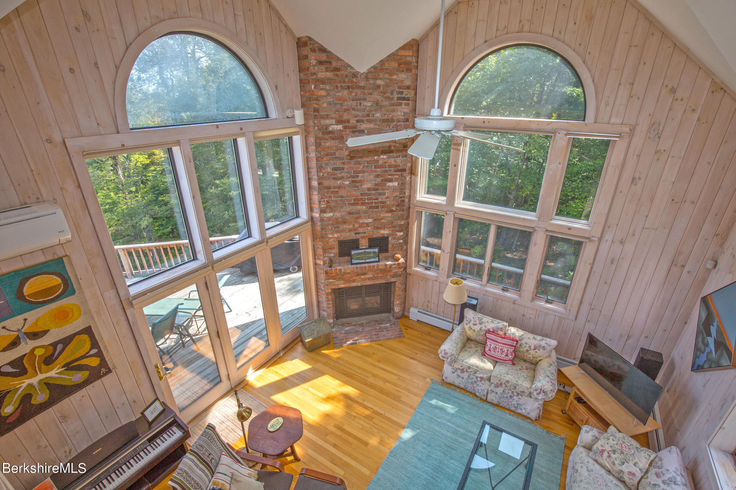 795 Moberg Road Becket, MA 01223 - Photo 21 of 41 a living room with furniture and a large window