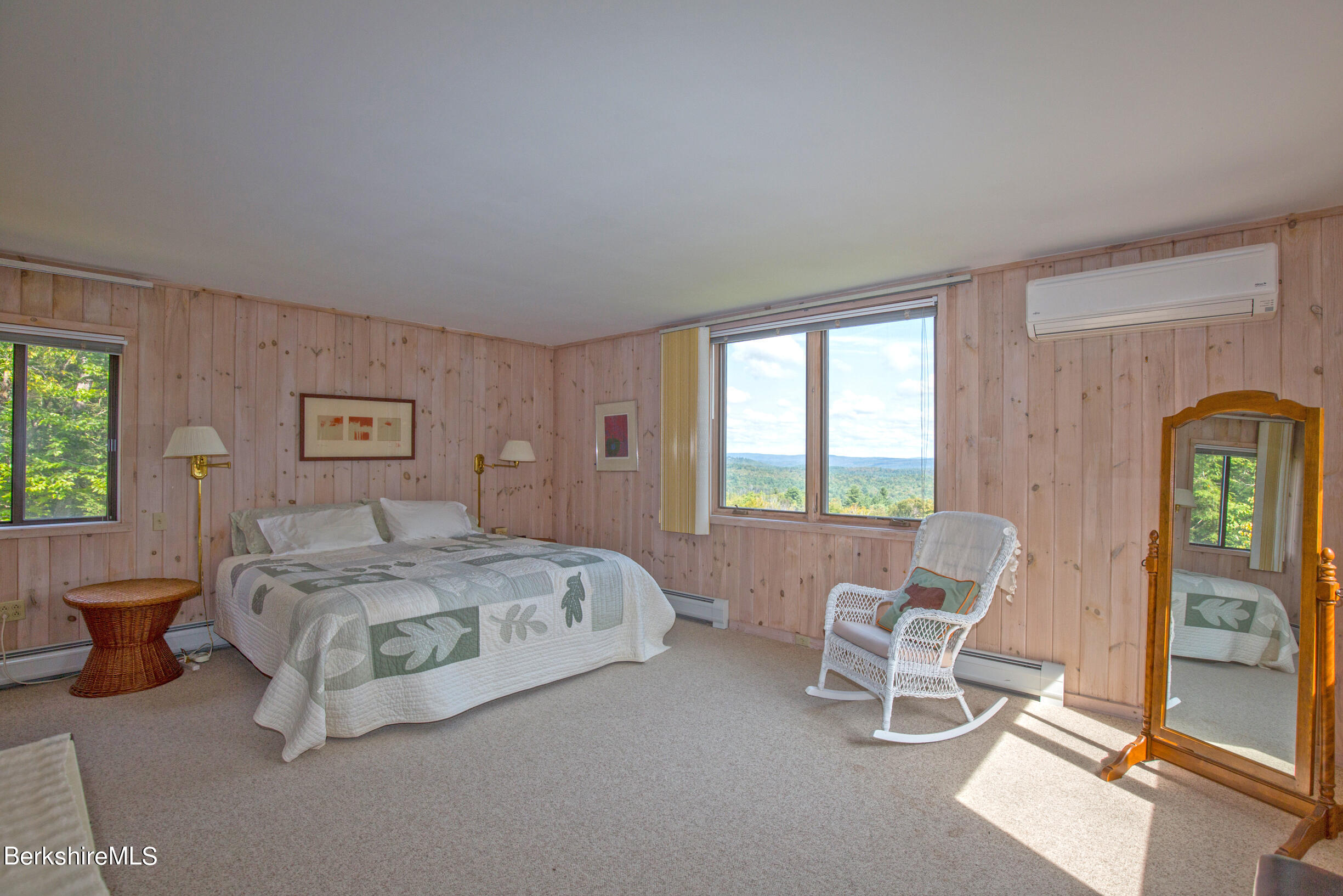 795 Moberg Road Becket, MA 01223 - Photo 22 of 41 a spacious bedroom with a bed and a window