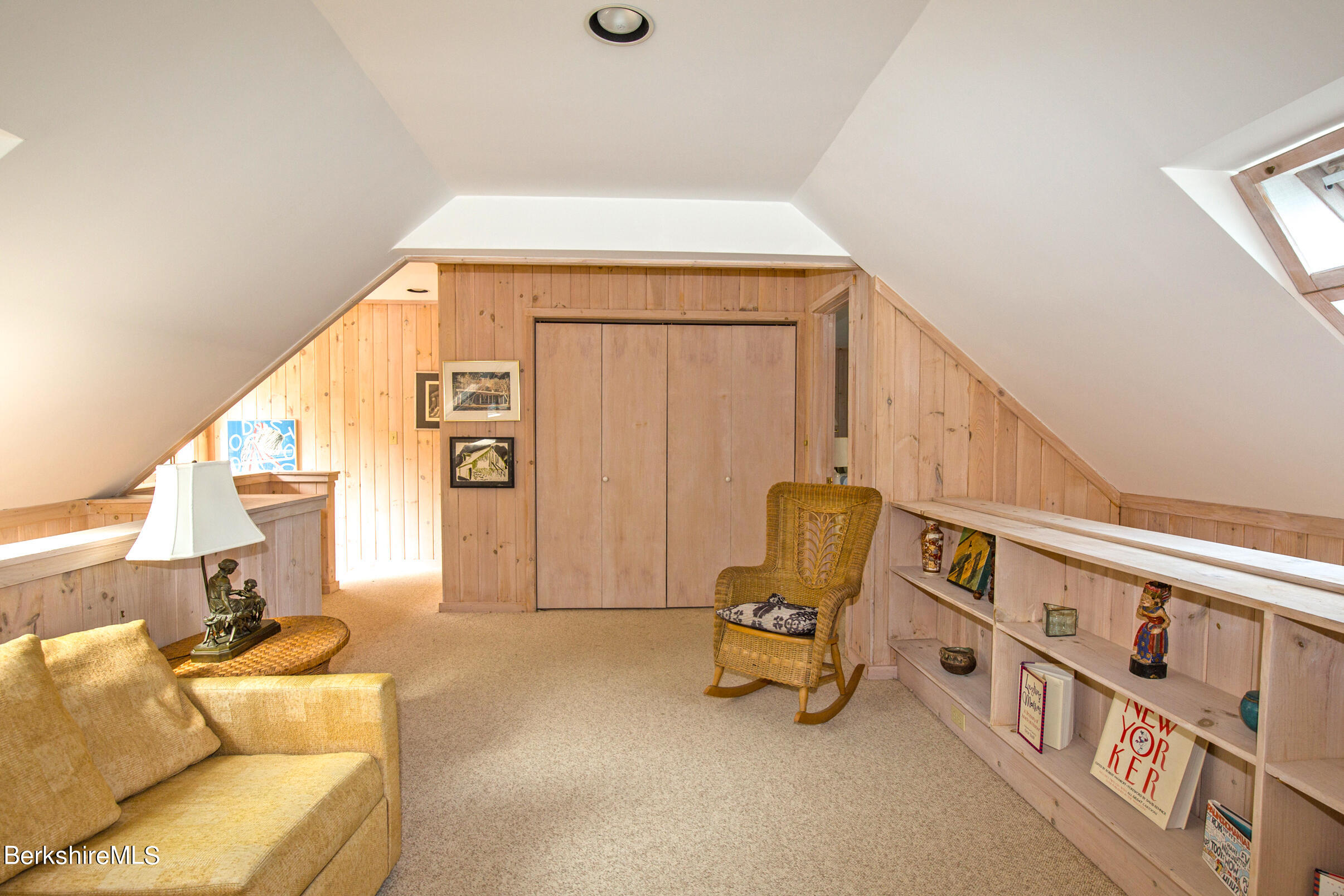 795 Moberg Road Becket, MA 01223 - Photo 28 of 41 a living room with furniture and a chair